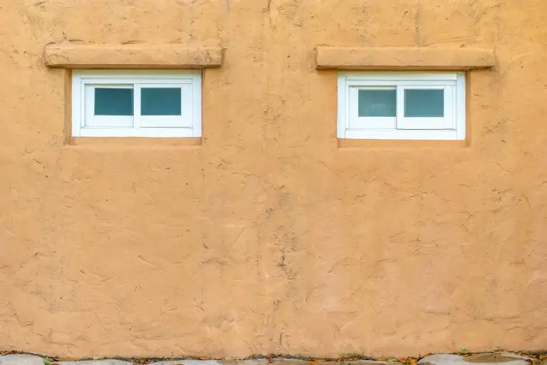 stucco-orange-wall-with-white-window-texture-backg-2024-11-29-14-04-31-utc-min